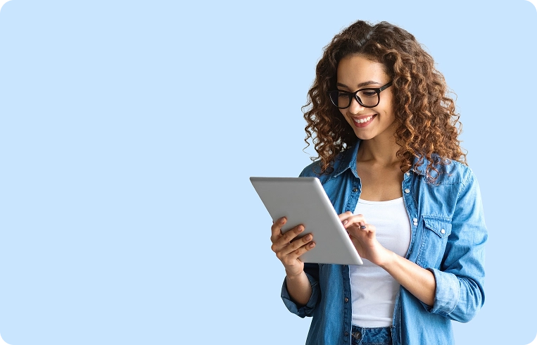 Woman using a tablet alongside PiLog DQG Suite data quality and governance solutions integrated with SAP.