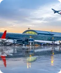 Airport terminal with aircraft on the runway, representing aviation operations and asset management.